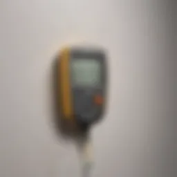 Moisture meter in action detecting drywall moisture levels